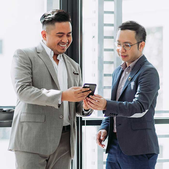 Two bankers reviewing financial information